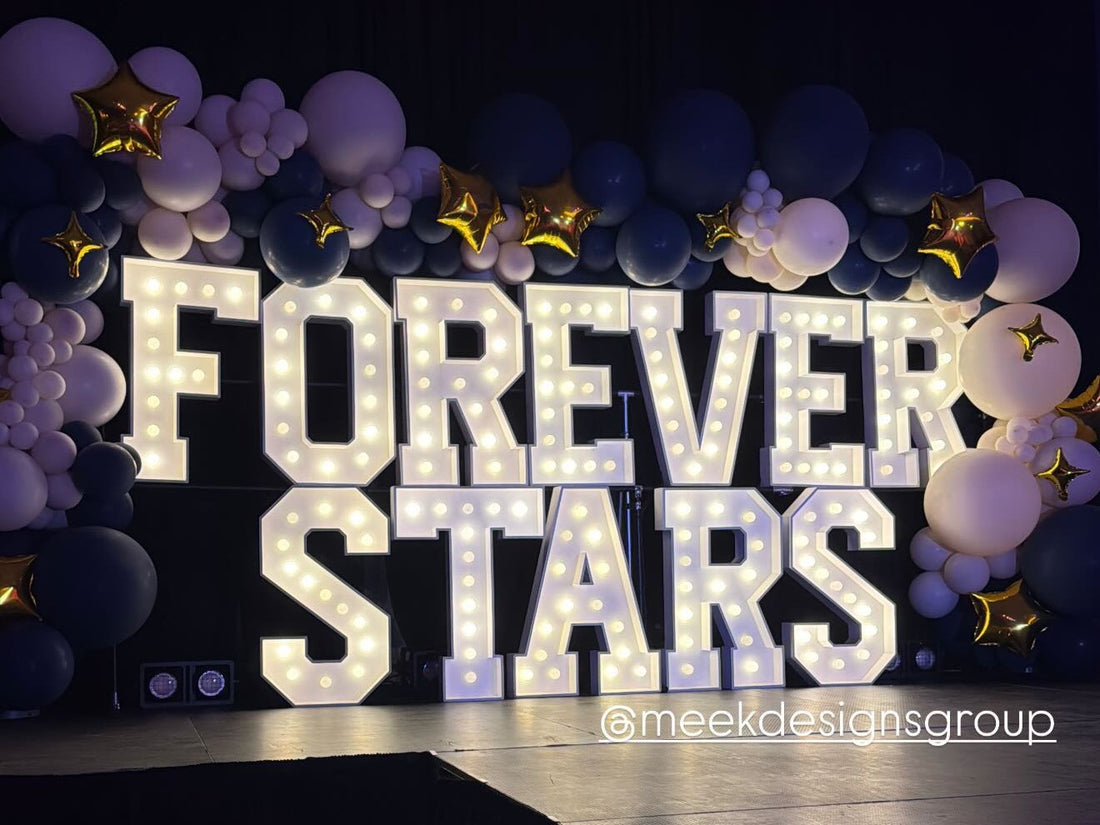 FOREVER STARS in 3 ft warm-white bulb marquee letters with navy and white balloons, Midland-Odessa event by Meek Designs